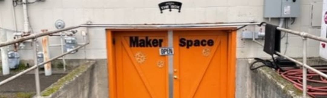 The Box entrance — orange Maker Space doors
